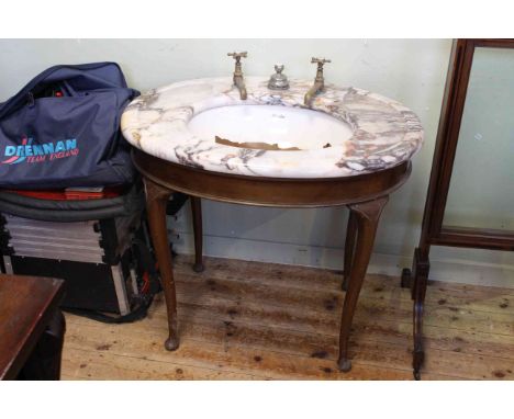 Country House mahogany oval cabriole leg table, with moulded marble top inset with wash basin and fitted with brass taps, 87.