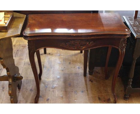 Victorian mahogany foldover card table, carved with foliage and raised on cabriole legs, 83cm