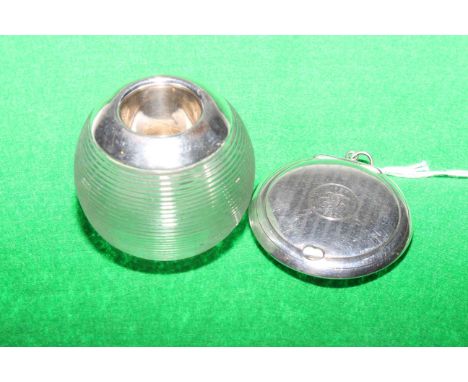 Small silver circular compact, Birmingham 1921, and silver mounted match striker (2)