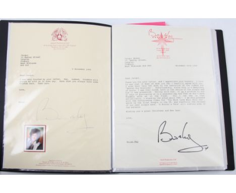 An album of Queen and Freddie Mercury photos and ephemera to include signatures; 8 Brian May, 4 John Deacon and 3 Roger Taylo