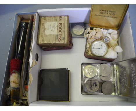 A recorder, three boxes of slides, a tin of coins, and a stop watch.