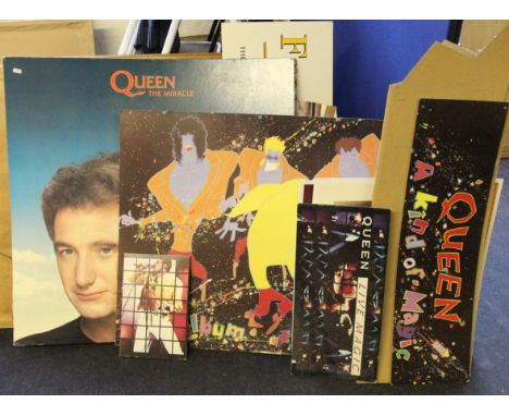A collection of Queen and Freddie Mercury card advertising boards including A Kind of Magic, The Miracle, The Freddie Mercury
