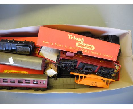 A box containing Tri-ang model trains and a Bayko building set.