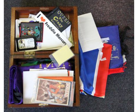 A collection of Queen memorabilia to include fan club paperwork, tickets, flags, blazer badges etc.