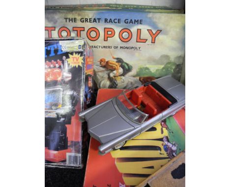 A Robot, car, two topoly, dominoes, bohg cutter(all boxed).