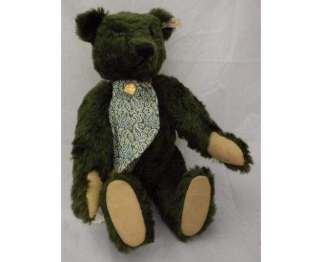 A Steiff Harrods musical bear, limited edition green plush, with button in ear, playing "The Anniversary Waltz" CONDITION REP