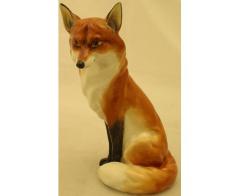 A Royal Worcester figure of a seated fox (2993) CONDITION REPORTS Age unknown.  Some light surface scratches and some build u