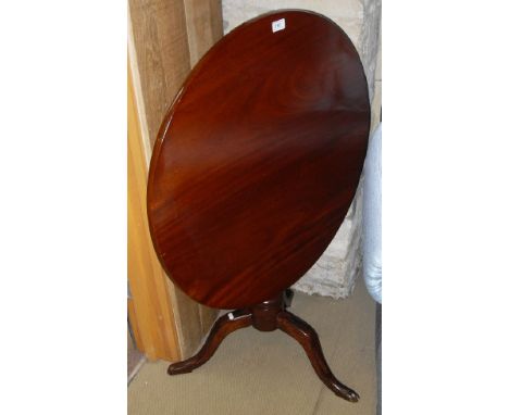 A 19th Century mahogany tea table, the circular snap top on a tripod pedestal base