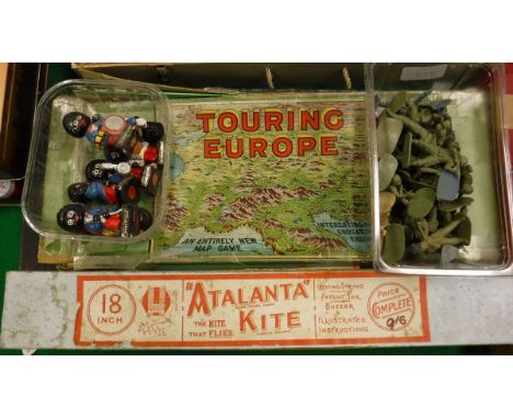 A seven piece hand painted plaster Robertson Golly ban, box of plastic toy soldiers, map game "Touring Europe", vintage Monop