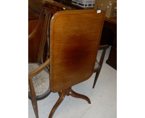 A late Regency / George IV mahogany occasional table, the rounded rectangular snap top with ebony stringing and reeded edge o