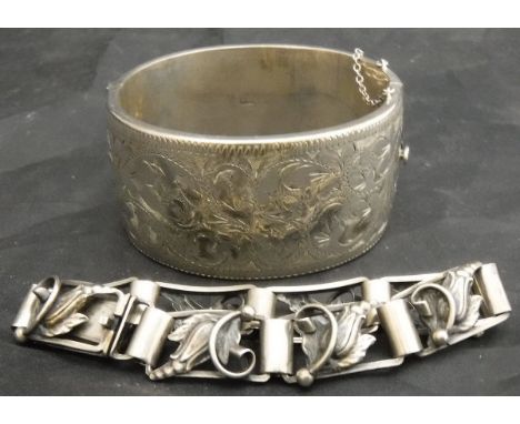 A Danish silver link bracelet with scrolling flower head and foliate decoration stamped "AK830S" .63 oz, together with an eng