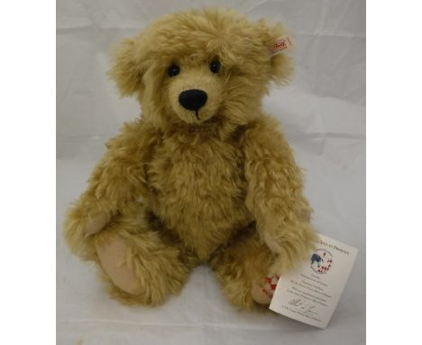 A Steiff "Monaco Aide et Presence 20 Ans d'Amour" bear, gold plush with boot button eyes and growler, button in ear CONDITION