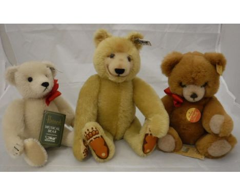 A Steiff "1985" bear, a Steiff musical bear, limited edition of 2000 for Harrods and a Steiff "Petsy" bear, all with button i