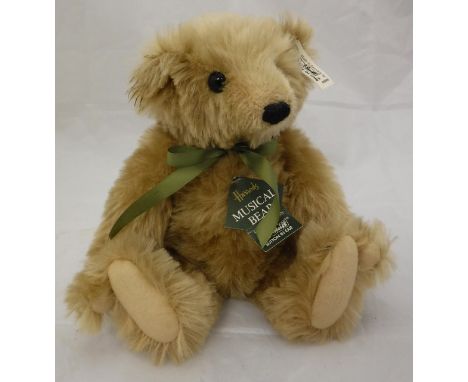 A Steiff Harrods musical bear, limited edition, gold plush with boot button eyes, button in ear CONDITION REPORTS Bear has ge