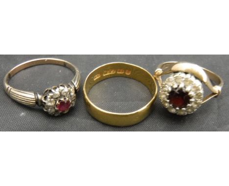 A 22-carat gold wedding band, a ruby and diamond dress ring and a garnet and paste dress ring 9.5 g overall