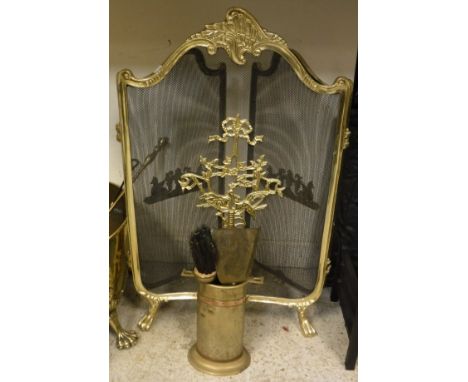 A gilt decorated three section fire screen, together with a brass pot and contents of fireside companion tools