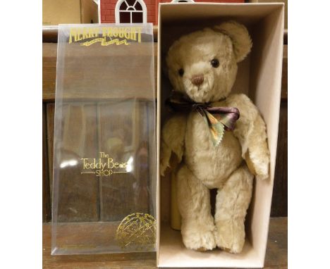 A Merrythought limited edition millennium bear, mohair with jointed arms and glass eyes, together with a vintage jigsaw puzzl