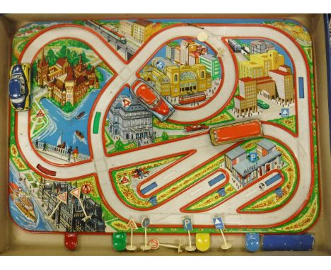 A 1950's Lemez (Hungarian) tin and lithographed town car game with wind-up vehicles and simple push-button control units