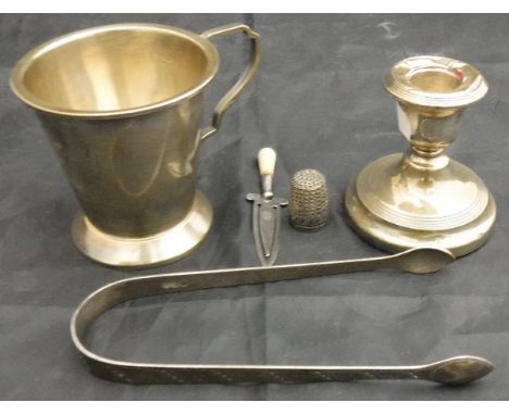 A George V silver Christening mug of conical form (Birmingham 1934), a silver thimble, a pair of silver sugar tongs (by Peter