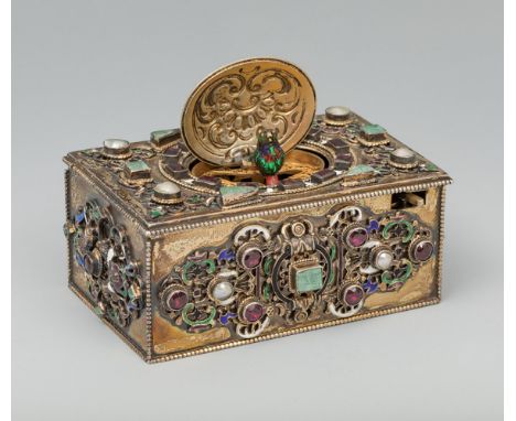 Music box with automaton, after 17th century models; late 19th century.Silver, enamelled with emerald, river pearls and garne