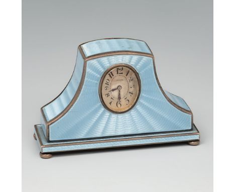 ZENITH travel clock. Ca. 1900. Partially gilt silver and blue guilloché enamel. White dial, Arabic numerals, obelisk hands.Me