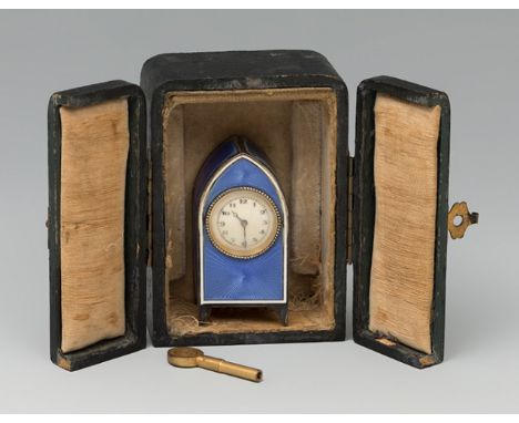 Table clock. Late 19th century. Silver and blue guilloché enamel. White dial, Arabic numerals, Breguet hands. With key. Non o