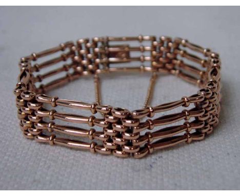 A 9ct gold ladies Gate Bracelet of typical form with 9ct gold clasp and safety chain, 18.5g, 18cm long 
