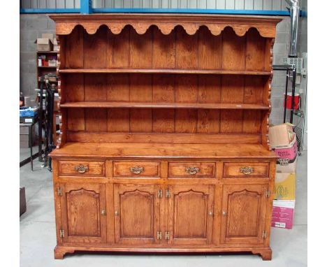 Royal Oak of Grassington, a top quality hand crafted oak George III style Dresser, moulded edge rectangular top above a line 