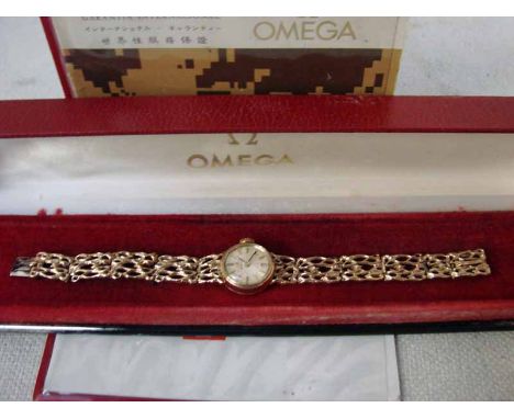 A ladies 9ct gold Omega Wrist Watch, circular silvered dial with gilt baton markers, signed Omega Swiss Made with Omega Cyphe