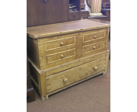 An early Victorian light elm blanket chest, hinged top enclosing recess with candle-tray, four mock-drawer fronts, single lon