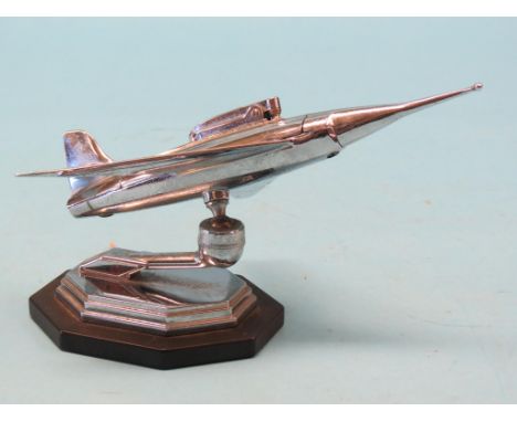 A novelty aeronautical table-lighter, chromium jet aircraft adjustable on angular plinth