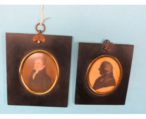 A 19th century miniature on ivory, half-length portrait of a young gentleman and a 19th century painted silhouette portrait, 