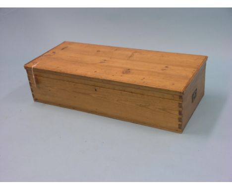 A pine trunk, with brass carrying handles, 3ft. 2in.
