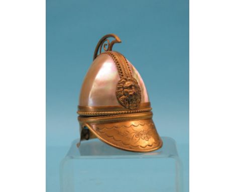A late 19th century gilt-brass and mother of pearl portrait photograph holder, in the form of a helmet, with embossed lion ma