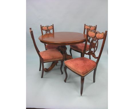 A Victorian-style mahogany breakfast table, circular top on carved stem and tripod base, top 3ft. 6in., together with a set o