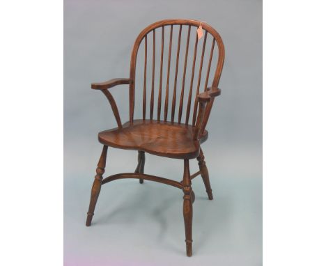 A period-style stick-back elbow chair, ash with elm seat and crinoline stretcher