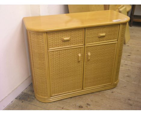 A light beech side cupboard, two drawers and cupboard doors, woven wicker finish, 3ft. 2in.