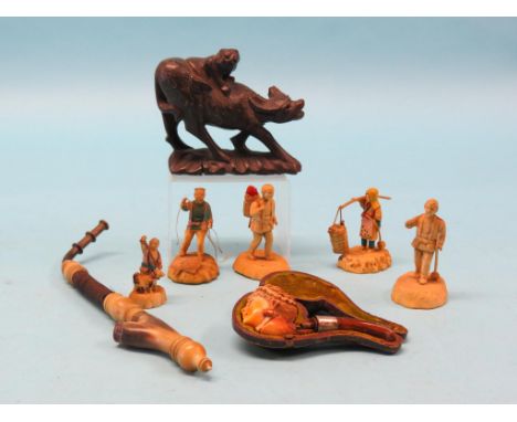 A silver-mounted meerschaum pipe, original leather case, a Swiss horn pipe, carved wood box and five celluloid figures