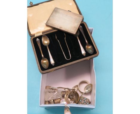 An engine-turned silver cigarette case, approx. 5oz., pair of similar napkin rings, cased part set of silver teaspoons and ot