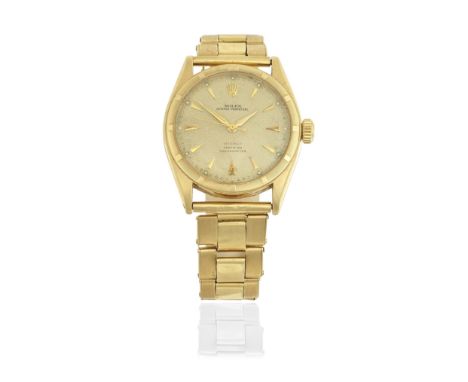 Rolex. An 18K gold automatic bracelet watch with original papersModel: Oyster PerpetualReference: 6085Date: Purchased 30th Ju