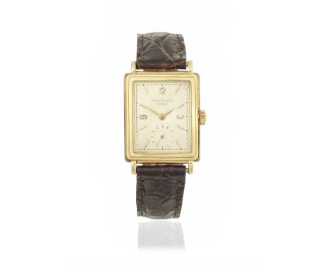 Patek Philippe. An 18K gold manual wind rectangular wristwatchReference: 2465Date: Manufactured 1951, sold April 29th 1952Mov