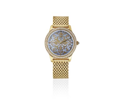 William &amp; Son. An unusual 18K gold and diamond set automatic bracelet watch with Khanjar emblem and enamel dialDate: Circ