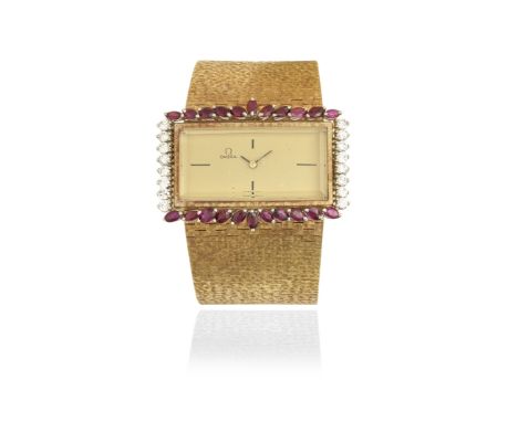 Omega. A lady's 18K gold ruby and diamond set manual wind bracelet watchDate: Circa 1970Movement: 17-jewel Cal.485 manual win