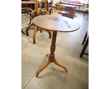 A Victorian oak circular tripod wine table 