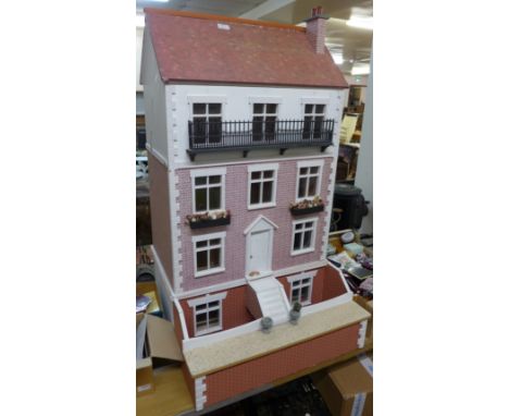 A large vintage dolls house, with furnishings and figures 