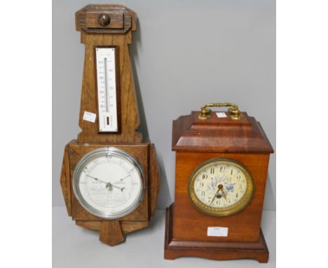 An Arts and Crafts mahogany mantel clock and an Art Deco oak barometer 