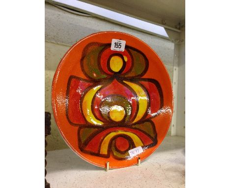 A Poole Pottery Delphis dish, shape 4, decorated in an abstract pattern on orange ground.