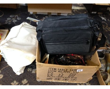 A box of cameras including a Zeiss Ikon Contaflex, other cameras and camera equipment.