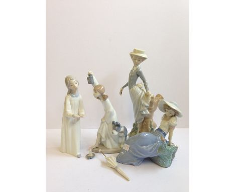 A Lladro china figure modelled as a Young Girl holding an umbrella together with another modelled as a Young Girl in a nightd