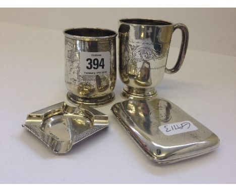 Two silver Christening tankards together with a silver cigarette case and a small Art Deco engine turned silver ashtray.